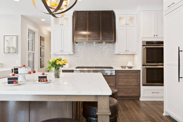 istock Lovely white cabinets and countertops in new kitchen 1262993228