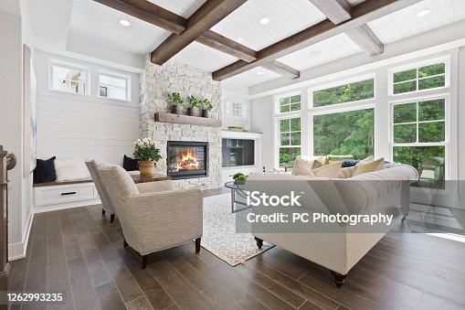 istock Family room with a wall full of windows 1262993235