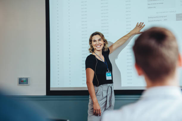 istock Smiling businesswoman giving a presentation 1262993342
