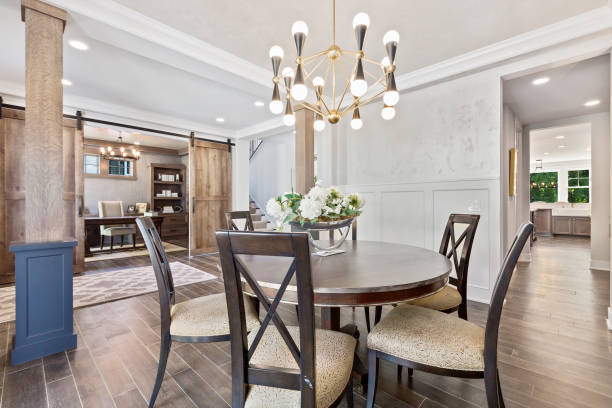 Dining area with small round wood table in newly built home