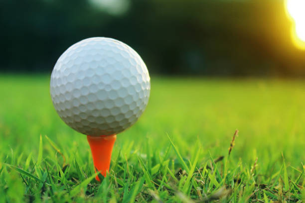 istock golf ball on tee in a beautiful golf course with morning sunshine 1262995151