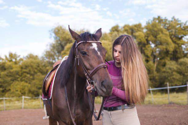 istock Young girl and her horse 1262998612