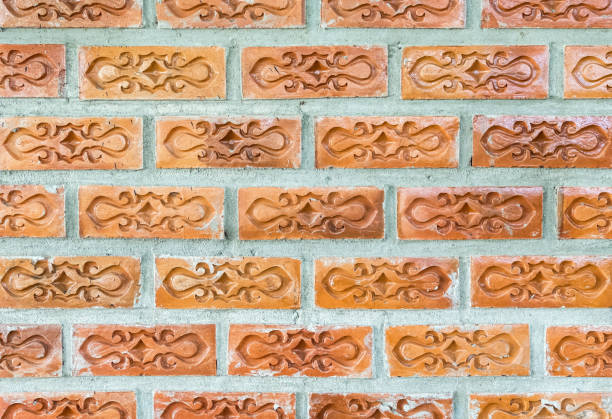 istock Red brick with the flower pattern on the concrete wall. 1263003958