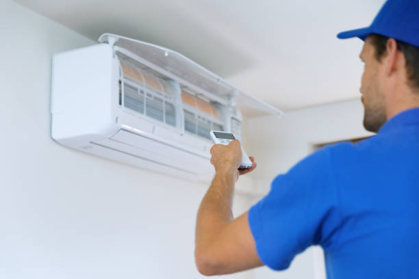 istock air conditioning - worker install conditioner in the room 1263004816