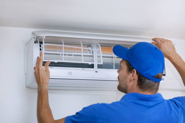 istock air conditioner maintenance and repair service. hvac technician working 1263004817