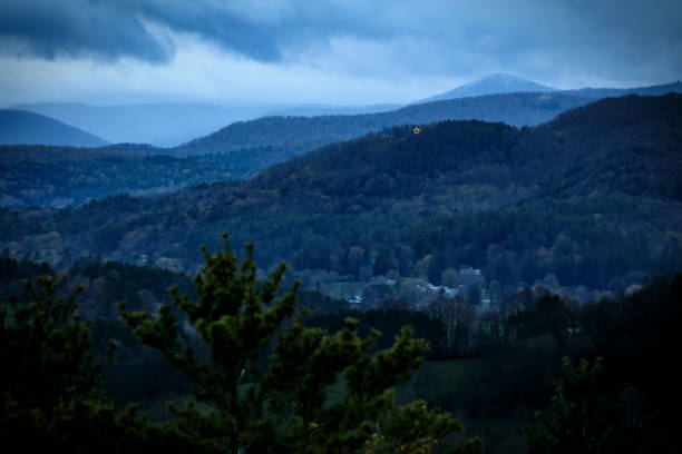 dusk over woodstock, vermont and the town's traditional holiday star. - valley storm thunderstorm mountain imagens e fotografias de stock