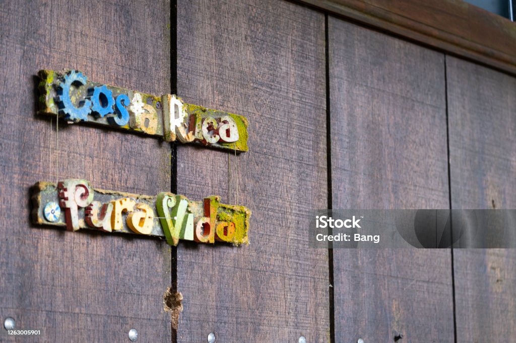 Pura Vida Costa Rica Signage Wood background and metal Costa Rica sign. Adventure Stock Photo Pura Vida Costa Rica Signage Wood background and metal Costa Rica sign. Adventure Stock Photo
