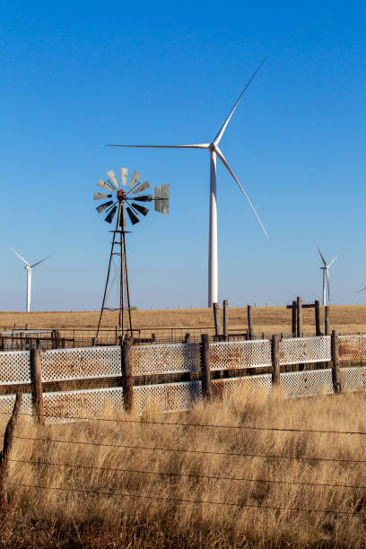 Kansas Wind Farm with windmill Kansas Wind Farm with windmill in Pratt, KS, United States barbed wire wire factory sky stock pictures, royalty-free photos & images