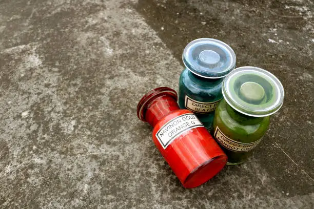 Old jars of textile colors in Agartala, TR, India
