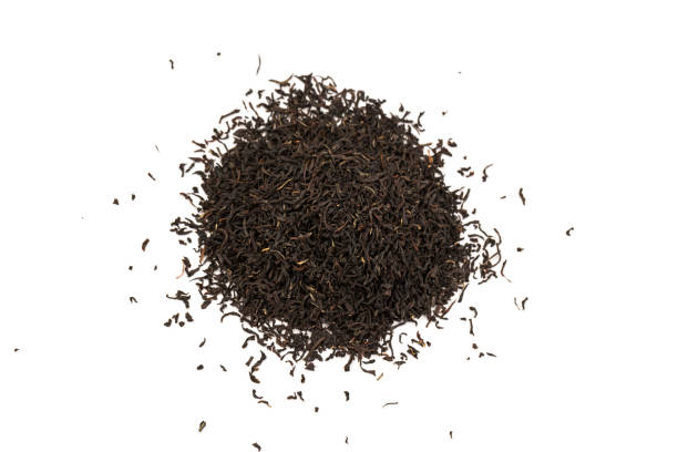 istock Fragrant Leaves of black premium dry tea on a white background 1263009630