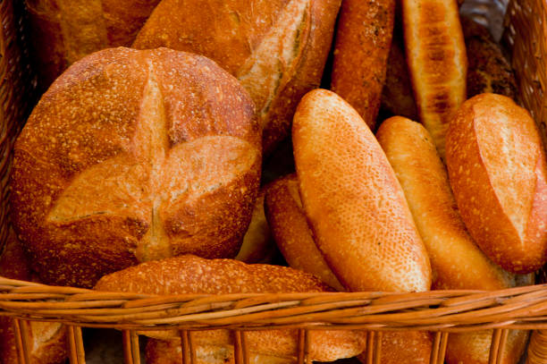 istock Bread, rolls, baguettes, Bagels, croissants, muffins, cinnamon rolls & donuts served w/ cream cheese, butter, jelly & jams. Classic American or French style breakfast or brunch. Variety of breakfast breads & pastries. 1263010443