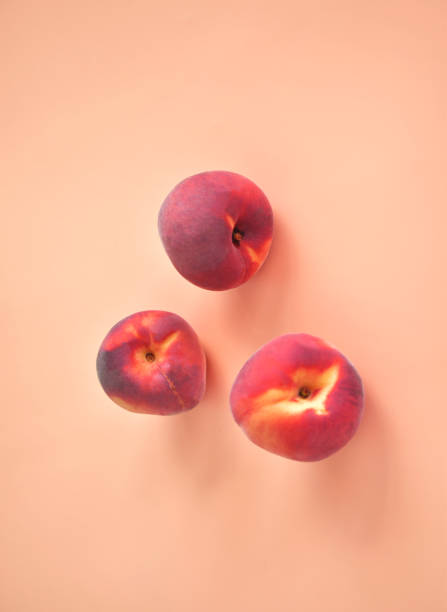 istock Ripe peaches on a beige background. Space for text. 1263011833