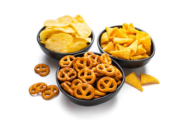 istock Salty snacks: potato chips, pretzels and corn bugles isolated on white background 1263013700