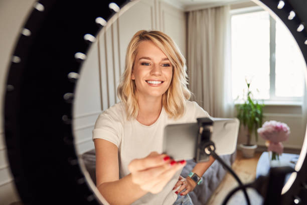 istock Gladsome young blogger preparing for live stream 1263014989