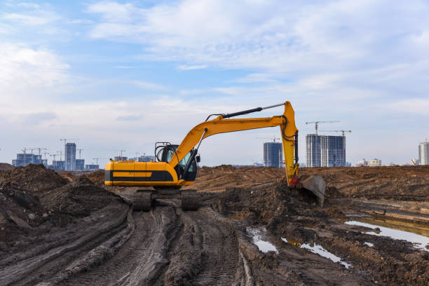 istock Excavator during excavation at construction site.  Backhoe on Earthworks 1263016092