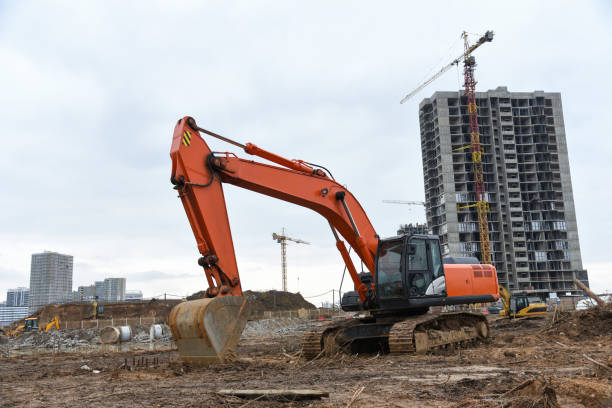 istock Excavator during excavation at construction site.  Backhoe on Earthworks. Heavy Construction Equipment Machines in Action 1263016194