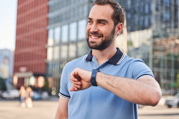 istock Happy young man with tracker in city centre 1263016994