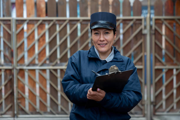 istock Security guard working at a gated community and looking at the camera smiling 1263019810
