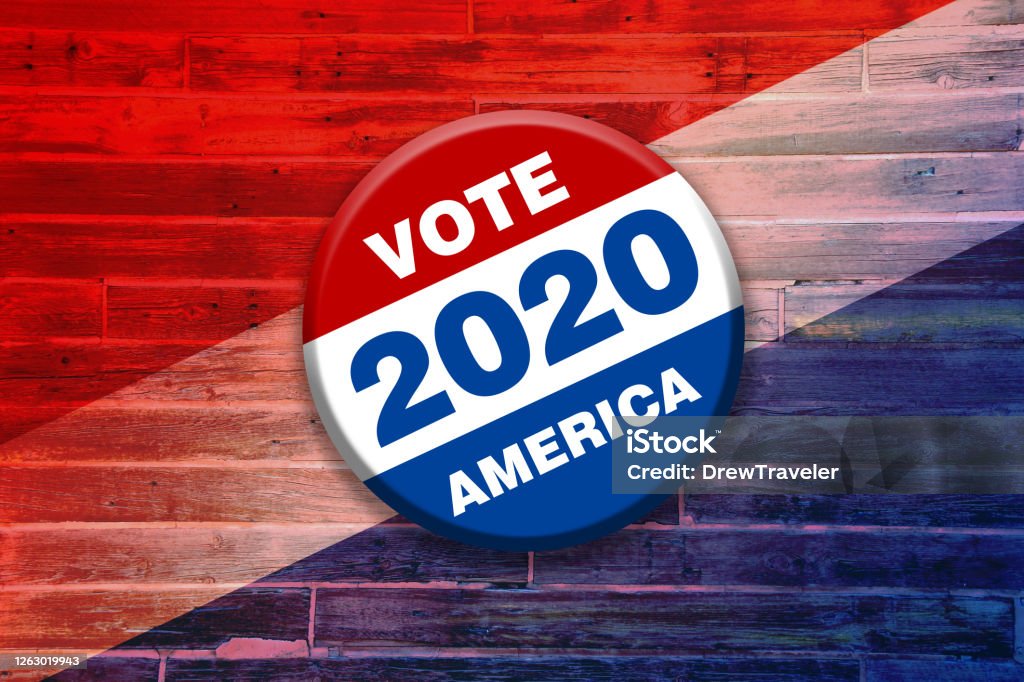 vivid red white blue vote 2020 america button pin on wood background featuring tilted gradient over faded stripes painted over wooden boards used as invitation card sign poster board 2020 Stock Photo