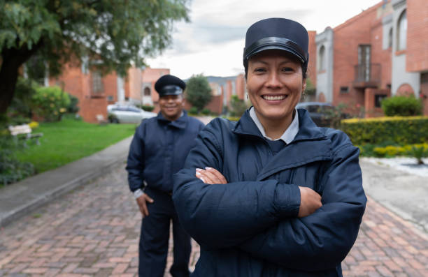 Team of security guards looking happy working at a gated community