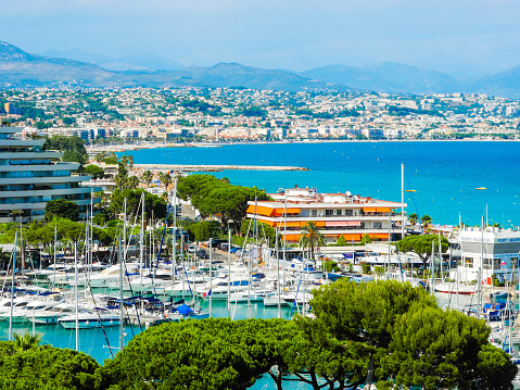 Marina Baie des Anges landscape on against backdrop of Mediterranean Sea with yachts and sailboats and the city of Nice in the background. Region Provence-Alpes-C?te d'Azur. Villeneuve-Loubet. France.