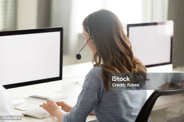 Call Center Operator Using Computer Looking At Screen Mock Up Stock Photo - Download Image Now
