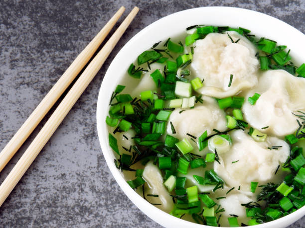 istock Dumplings in broth in Chinese style. Food sticks. 1263023247