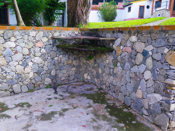 istock stone wall in the grass field 1263024037