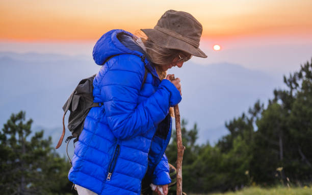 istock Side view of a hiker standing on the mountain 1263025527