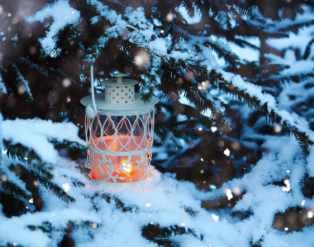 istock White lantern with burning candle outdoors 1263026575