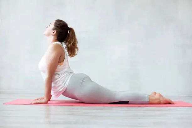 Photo of Lovely woman doing stretching or yoga exercise