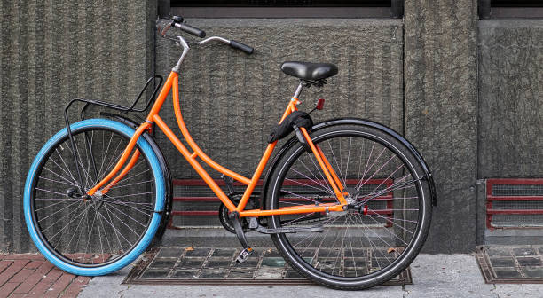 istock classical bike in vibrant multi color against old wall 1263027464