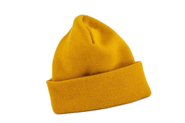 Yellow Knit Cap Isolated on White Yellow - Mustard color mercerized skull cap isolated on white background. beret stock pictures, royalty-free photos & images