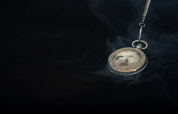 istock Watch vintage pocket  with smoke on black background. 1263031938