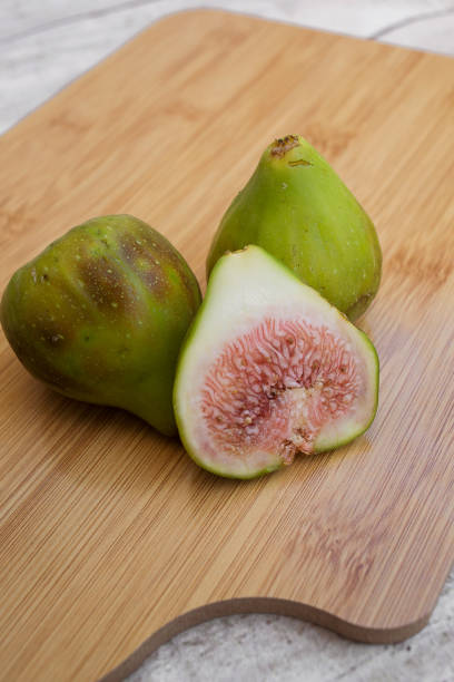close-up: whole and cut green figs