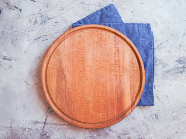 istock wooden kitchen board on concrete background 1263037042