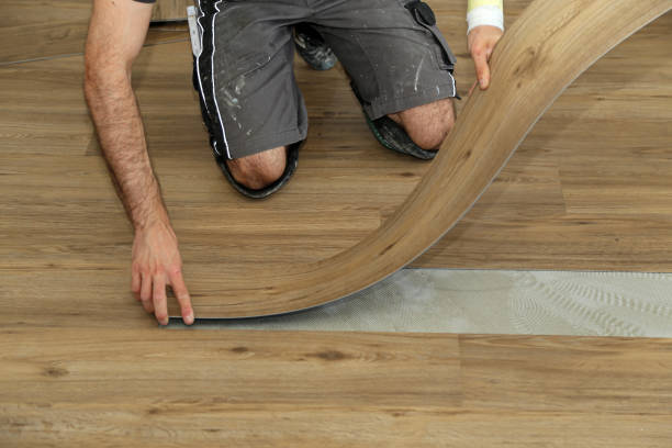 istock The worker installing new vinyl tile floor 1263037911