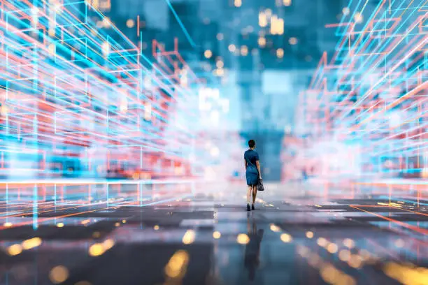 Photo of Futuristic city VR wire frame with businesswoman walking