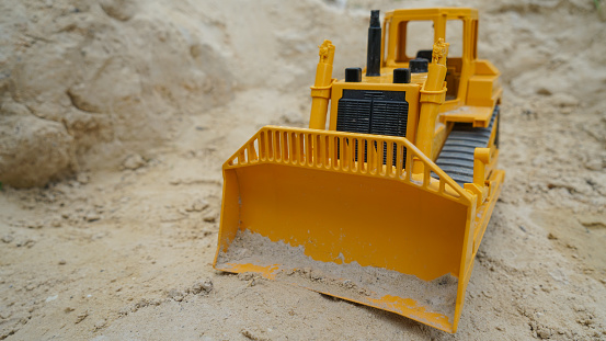 Child building a sand castle on the beach