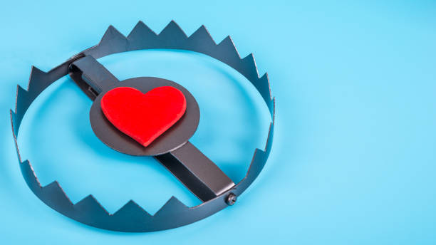 istock Heart in a trap on a blue background. 1263041934