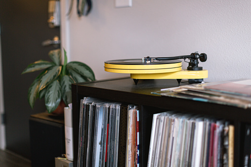 Record player in cozy living room stock photo.