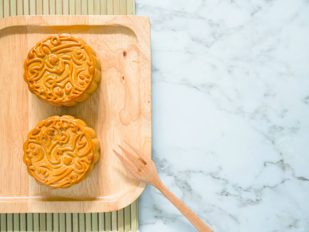 istock Mooncakes on a wooden plate with copy space 1263053611