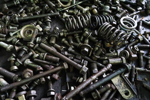 istock Old gears and old nut on wooden tables 1263053831
