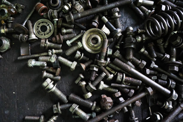 istock Old gears and old nut on wooden tables 1263053847