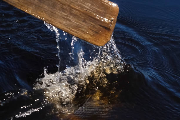 istock Paddle over surface of the water. Rowing a paddle in the river. 1263057227