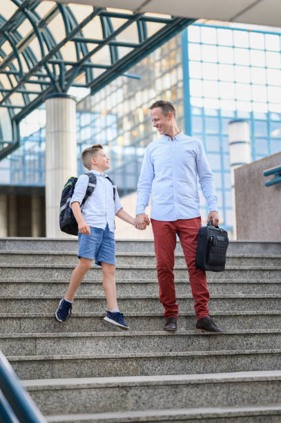 istock Working father taking his son to school. 1263057873