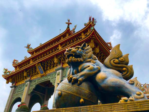 istock Bronze lion standing front of the temple 1263058876