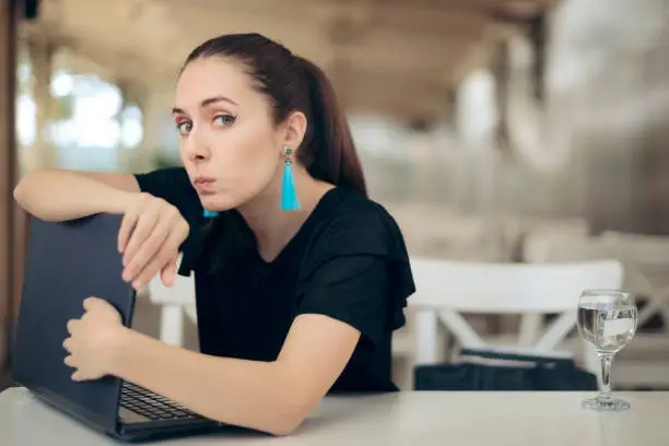 Photo of Woman with Laptop Worried About Online Privacy of Personal Data