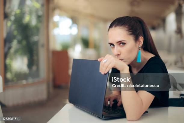 Woman With Laptop Worried About Online Privacy Of Personal Data Stock Photo - Download Image Now