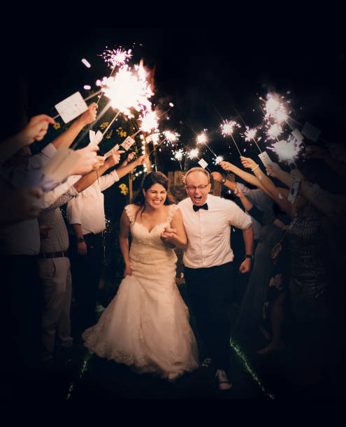 istock Newlyweds walking among sparkle lights on their day 1263063822